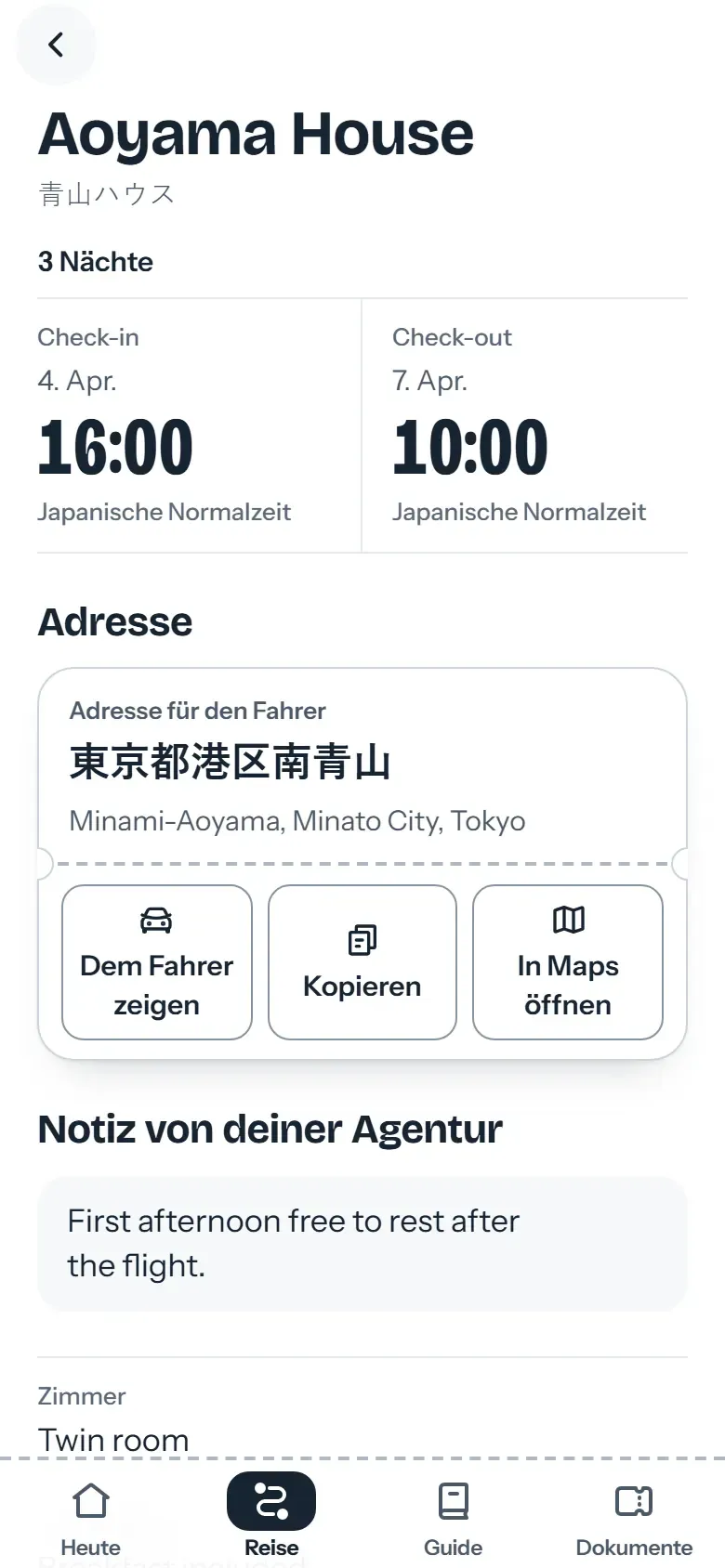 Hotelseite in der Reise-App mit der Adresse auf Japanisch und dem Button „Dem Fahrer zeigen“