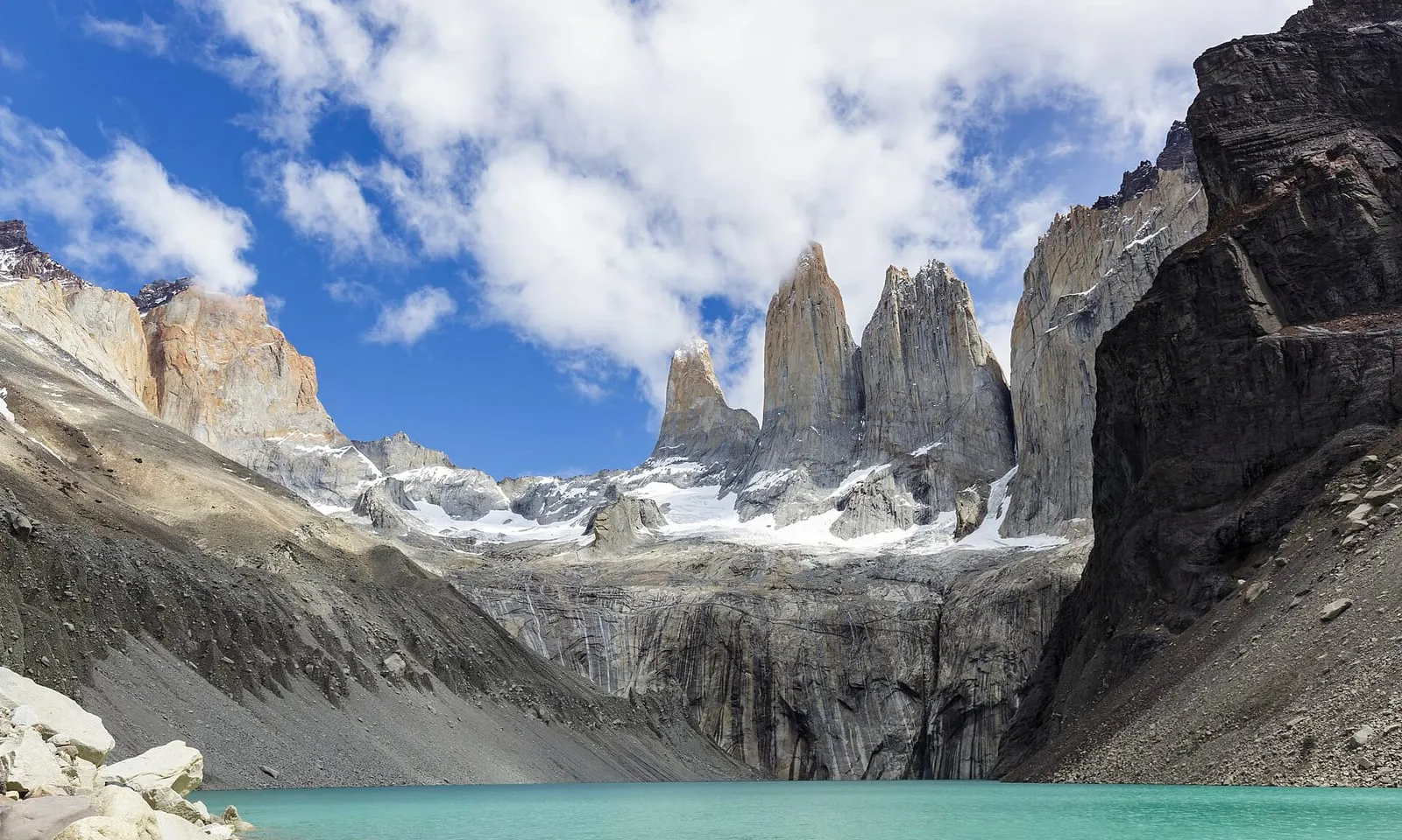 The granite towers of Torres del Paine above a turquoise glacial lake in Chilean Patagonia